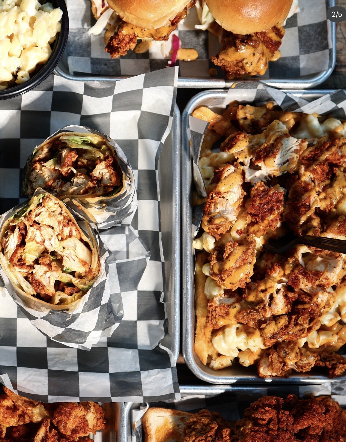 Hotbirds trays of hot chicken sliders, wraps, loaded fries and mac & cheese