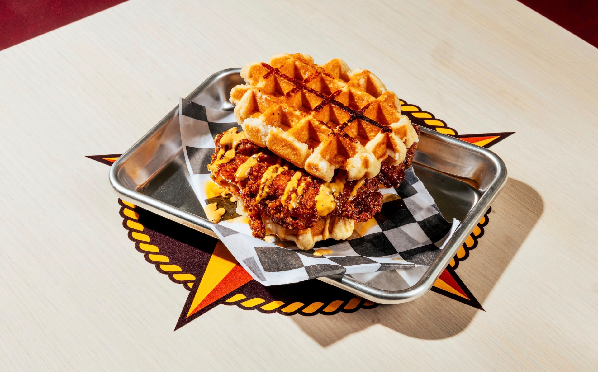 Hot chicken and waffle sandwich with comeback sauce